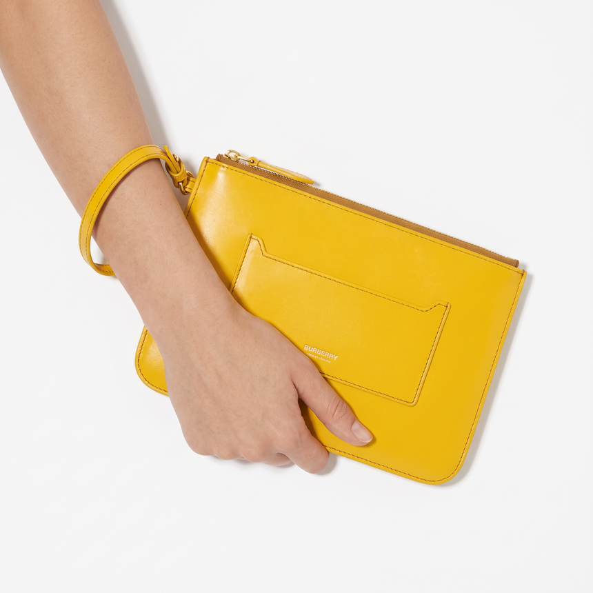 Burberry New Peyton Leather Clutch Bag in Yellow