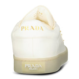 Prada Leather Trainers with Gold Metal Appliqué in Avorio - Boinclo - Outlet Sale Under Retail